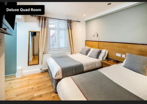 Habitación Doble Superior con 2 camas grandes del hotel Apollo Kings Cross. Foto 1