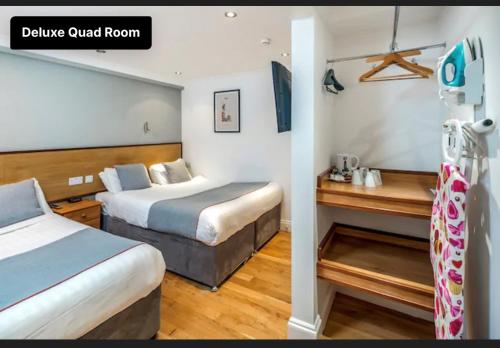 Habitación Doble Superior con 2 camas grandes del hotel Apollo Kings Cross. Foto 6