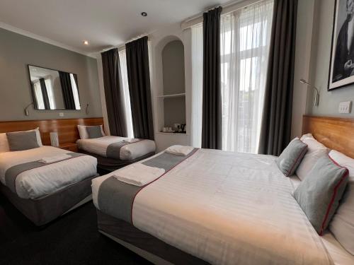 Habitación Cuádruple Deluxe del hotel Apollo Kings Cross. Foto 2