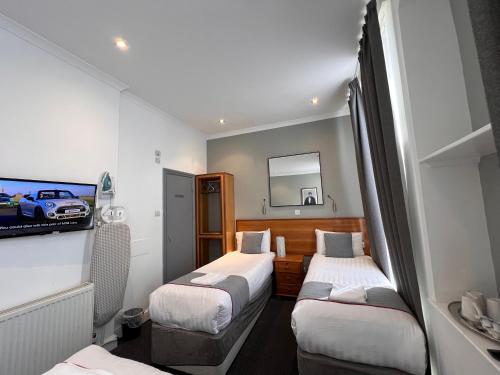 Habitación Cuádruple Deluxe del hotel Apollo Kings Cross. Foto 3