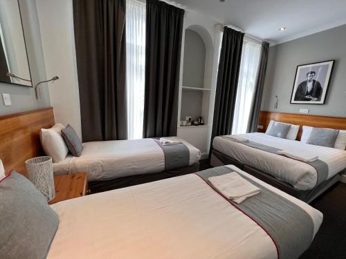 Habitación Cuádruple Deluxe del hotel Apollo Kings Cross. Foto 4