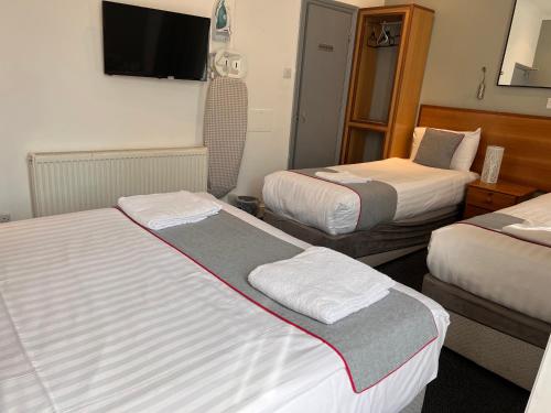 Habitación Cuádruple Deluxe del hotel Apollo Kings Cross. Foto 5