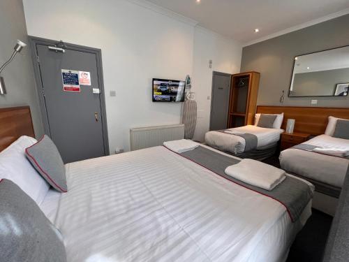 Habitación Cuádruple Deluxe del hotel Apollo Kings Cross. Foto 6