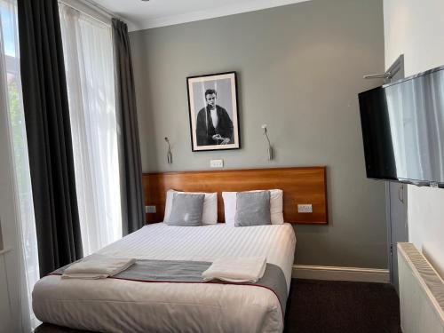 Habitación Cuádruple Deluxe del hotel Apollo Kings Cross. Foto 7