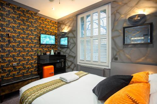 Habitación Rokxy con cama grande del hotel The Rokxy Townhouse - Kings Cross. Foto 13