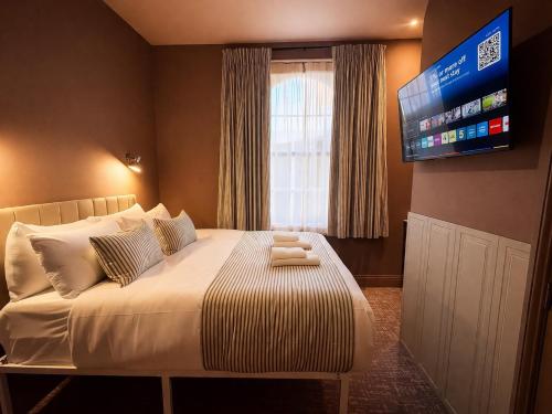 Habitación Rokxy con cama grande del hotel The Rokxy Townhouse - Kings Cross. Foto 22