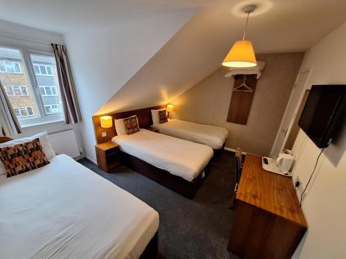 Habitación Triple del hotel Stockwood. Foto 2