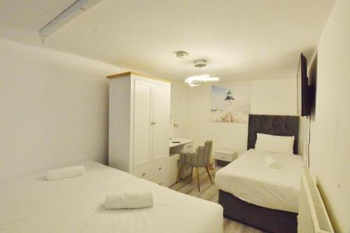 Habitación Triple pequeña del hotel Anchor House