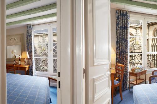 2 habitaciones comunicadas del hotel Relais Du Louvre. Foto 3