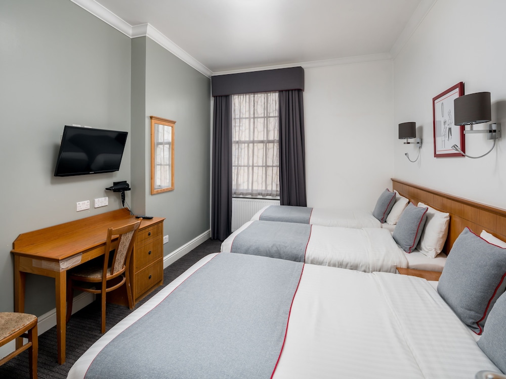 Habitación cuádruple Deluxe del hotel OYO TOWNHOUSE NEW ENGLAND VICTORIA