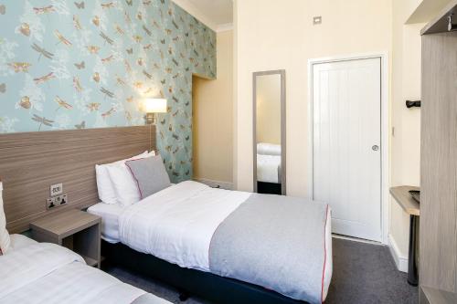 Habitación Doble Estándar - 2 camas del hotel OYO Bakers London Victoria. Foto 1