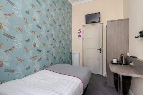 Habitación Individual con baño privado externo del hotel OYO Bakers London Victoria. Foto 2