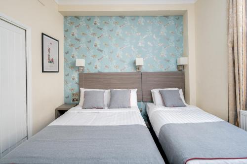 Habitación Triple Deluxe del hotel OYO Bakers London Victoria. Foto 2