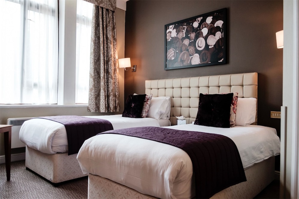 Habitación estándar con 1 cama doble o 2 individuales del hotel The Mad Hatter. Foto 4