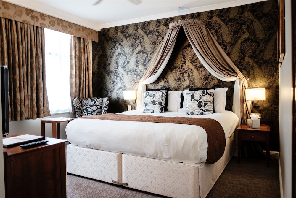 Habitación estándar con 1 cama doble o 2 individuales del hotel The Mad Hatter. Foto 6