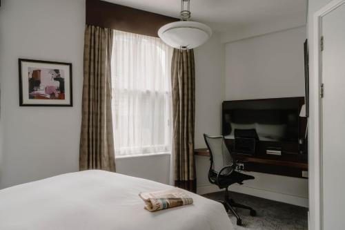 Habitación Estándar - 1 cama grande del hotel Club Quarters , Trafalgar Square. Foto 6