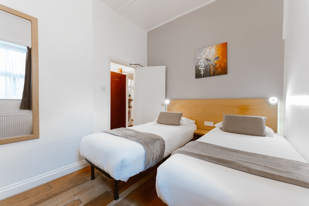 Habitación con 2 camas individuales del hotel Star ByB. Foto 1