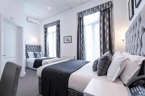 Habitación Familiar Clásica del hotel The Melita. Foto 4