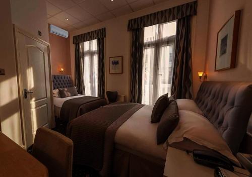 Habitación Familiar Clásica del hotel The Melita. Foto 8