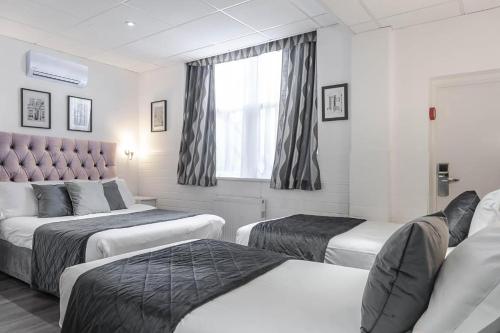 Habitación Familiar Clásica (4 personas) del hotel The Melita. Foto 5