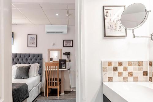 Habitación Familiar Clásica (4 personas) del hotel The Melita. Foto 6