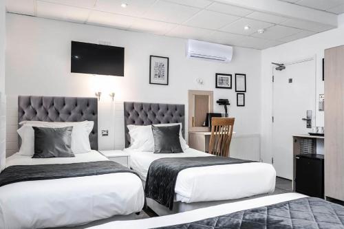 Habitación Familiar Clásica (4 personas) del hotel The Melita. Foto 7