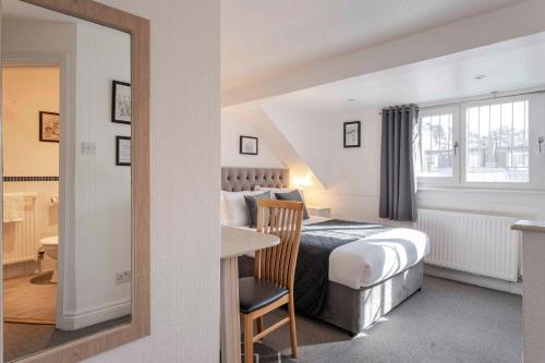 Habitación Familiar Clásica (4 personas) del hotel The Melita. Foto 12