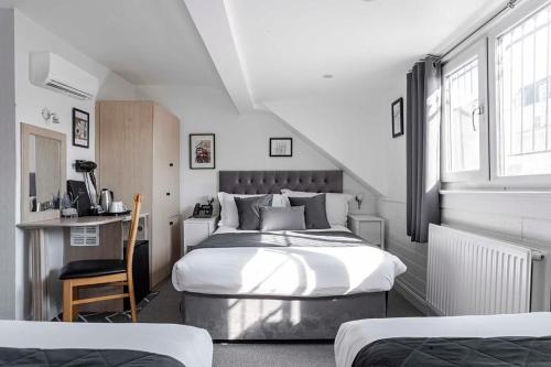 Habitación Familiar Clásica (4 personas) del hotel The Melita. Foto 13