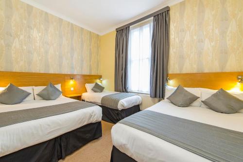 Habitación cuádruple del hotel Lidos. Foto 1