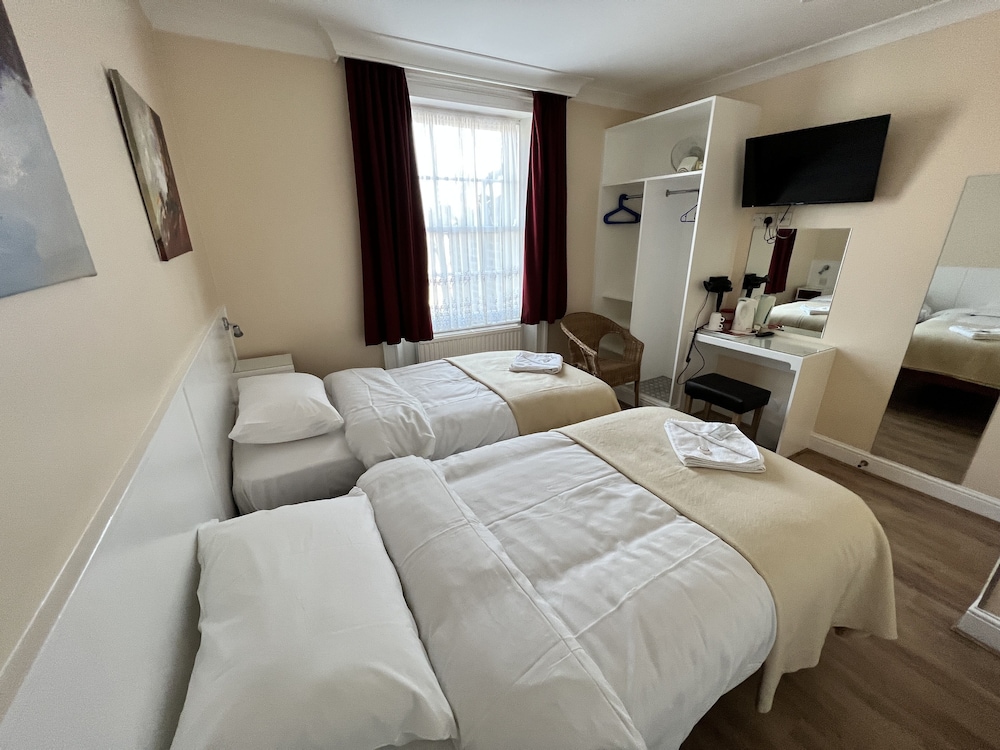 Habitación con 2 camas individuales del hotel Melbourne House. Foto 5