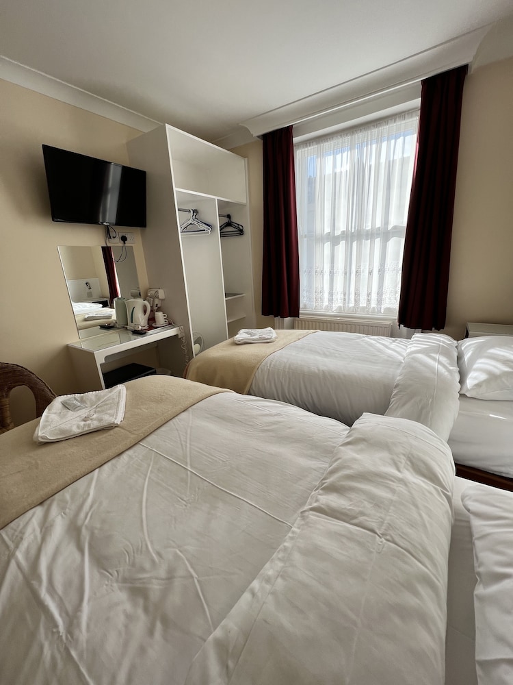 Habitación con 2 camas individuales del hotel Melbourne House. Foto 7
