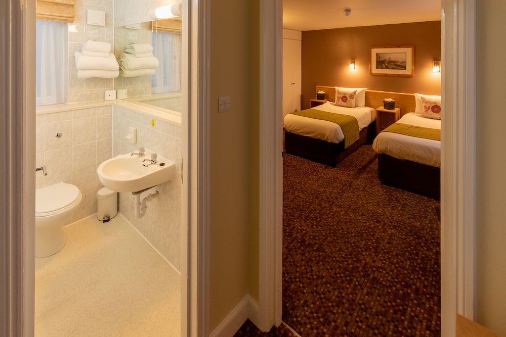 Habitación con 2 camas individuales del hotel The Darlington Hyde Park