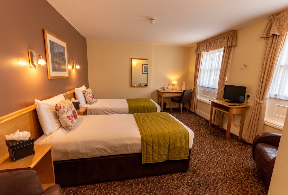 Habitación con 2 camas individuales del hotel The Darlington Hyde Park. Foto 1