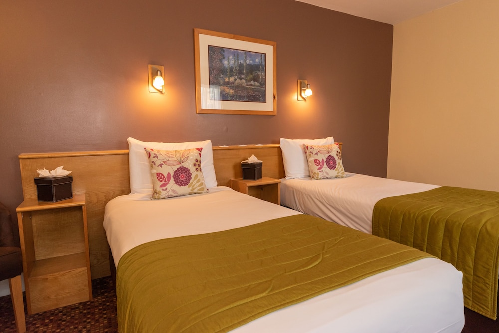 Habitación con 2 camas individuales del hotel The Darlington Hyde Park. Foto 2