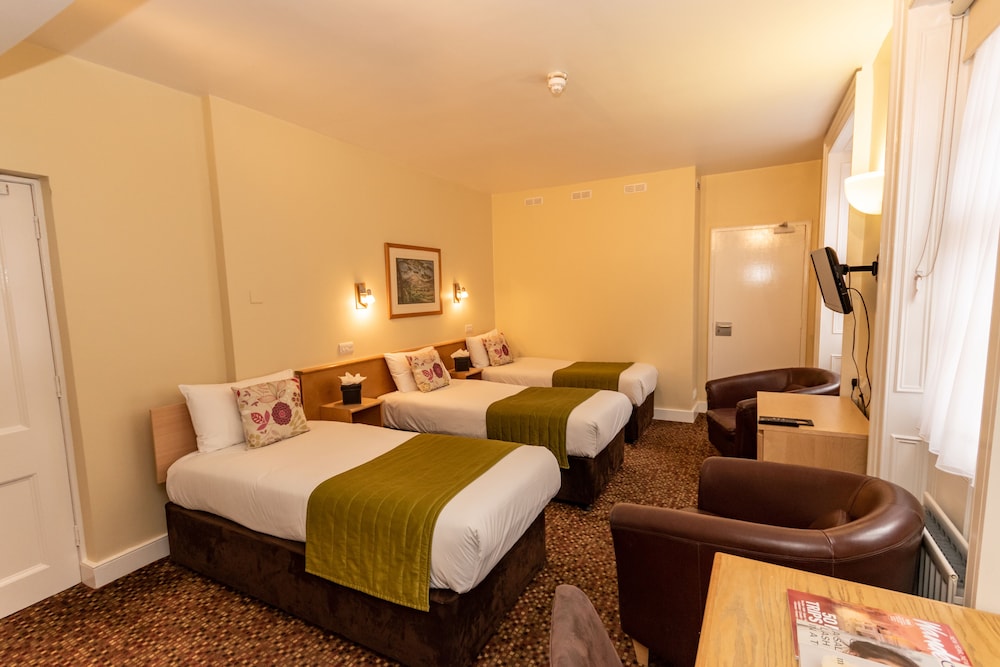 Habitación triple del hotel The Darlington Hyde Park