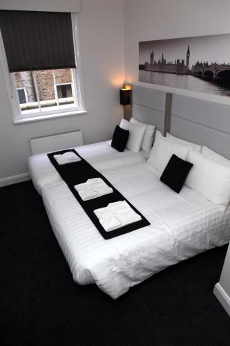 Habitación Triple del hotel The Omega. Foto 6
