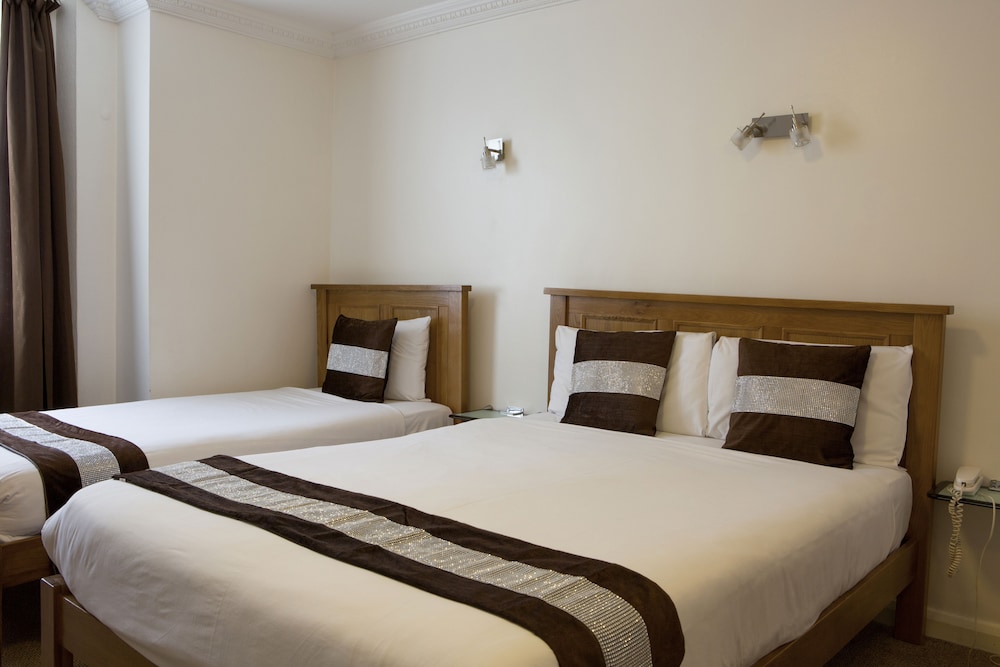Habitación triple del hotel Abbey Court, Hyde Park Hotels