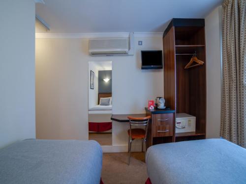 Habitación Doble Estándar - 2 camas del hotel Elysee Hydepark. Foto 1