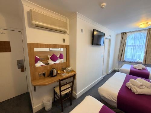 Habitación Cuádruple Deluxe del hotel Elysee Hydepark. Foto 4