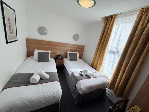 Habitación Doble Estándar - 2 camas del hotel Elysee Hydepark. Foto 12