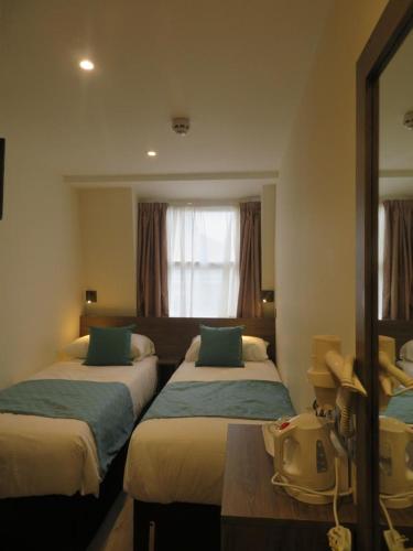 Habitación Doble - 2 camas del hotel Glendale Hyde Park. Foto 6