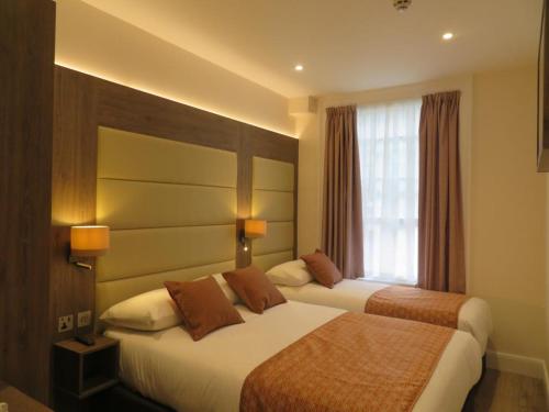 Habitación Triple del hotel Glendale Hyde Park. Foto 12