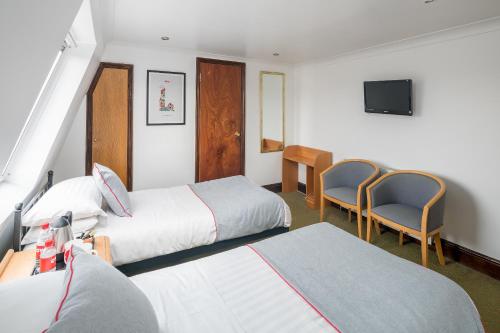 Habitación Doble Estándar - 2 camas del hotel Oyo Abbey , London Shepherd's Bush Market. Foto 6