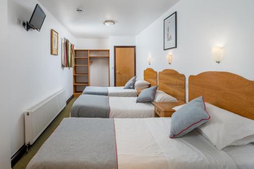 Habitación Triple Deluxe del hotel Oyo Abbey , London Shepherd's Bush Market. Foto 3