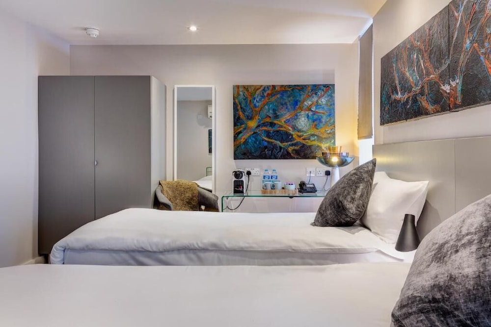 Habitación con 2 camas individuales del hotel 55. Foto 1