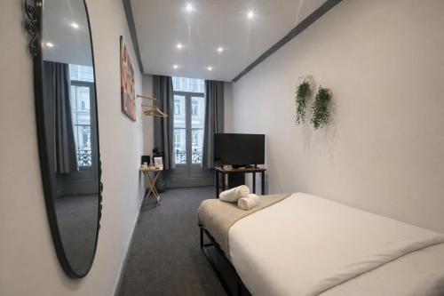 Habitación doble 1 Cama Individual del hotel Oyo Amsterdam. Foto 1
