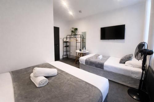 Habitación Triple Deluxe del hotel Oyo Amsterdam. Foto 8