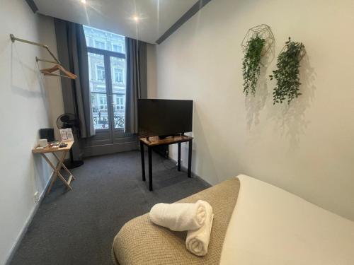 Habitación doble 1 Cama Individual del hotel Oyo Amsterdam. Foto 12