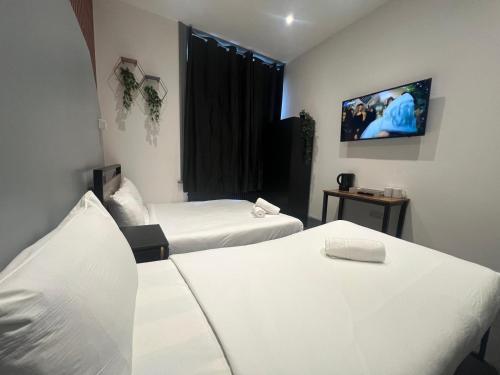 Habitación Triple Deluxe del hotel Oyo Amsterdam. Foto 13