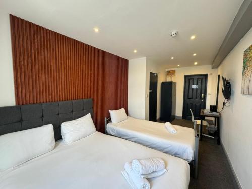 Habitación Triple Deluxe del hotel Oyo Amsterdam. Foto 15